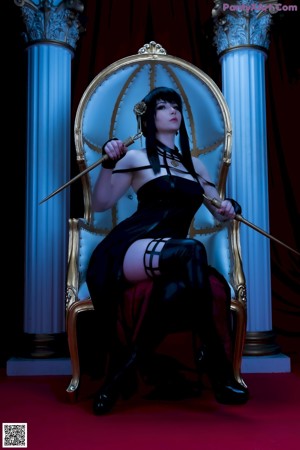 A 3D rendering of a woman in a black lingerie sitting on a red carpet.