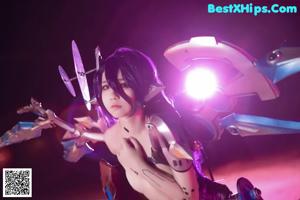 A woman with purple hair and a robot head.