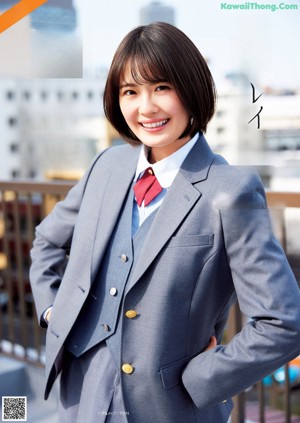 A woman in a school uniform is walking down the street.