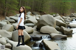 A woman in a school uniform posing for a picture.